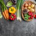 Fresh organic vegetables on rustic background